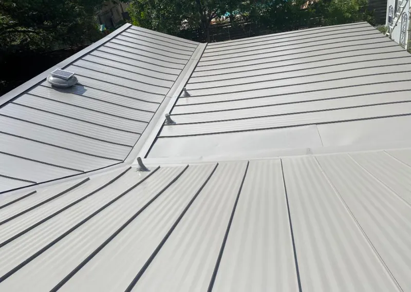 Solar attic fan installed on a metal roof for Roof Ventilation in Lake Los Angeles